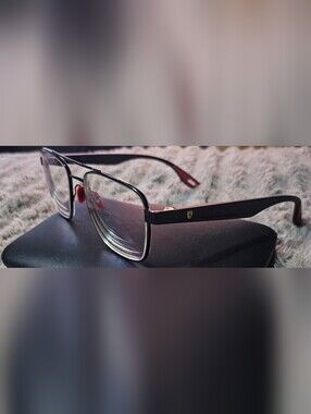 Ray-Ban Scuderia Ferrari collection eyeglasses with a matte black frame.read